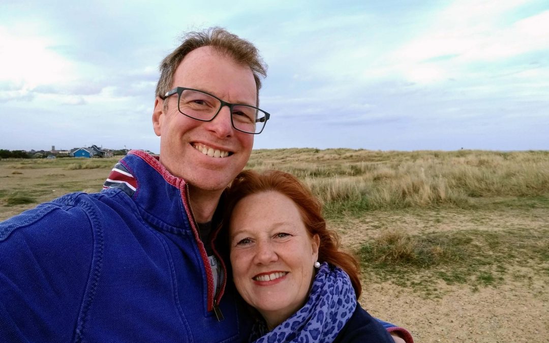 image shows Julie and Craig, a couple who foster with AFA, pictured outside